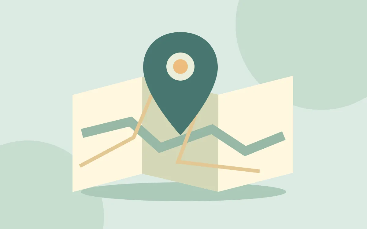 An illustrated folded map with a green location pin